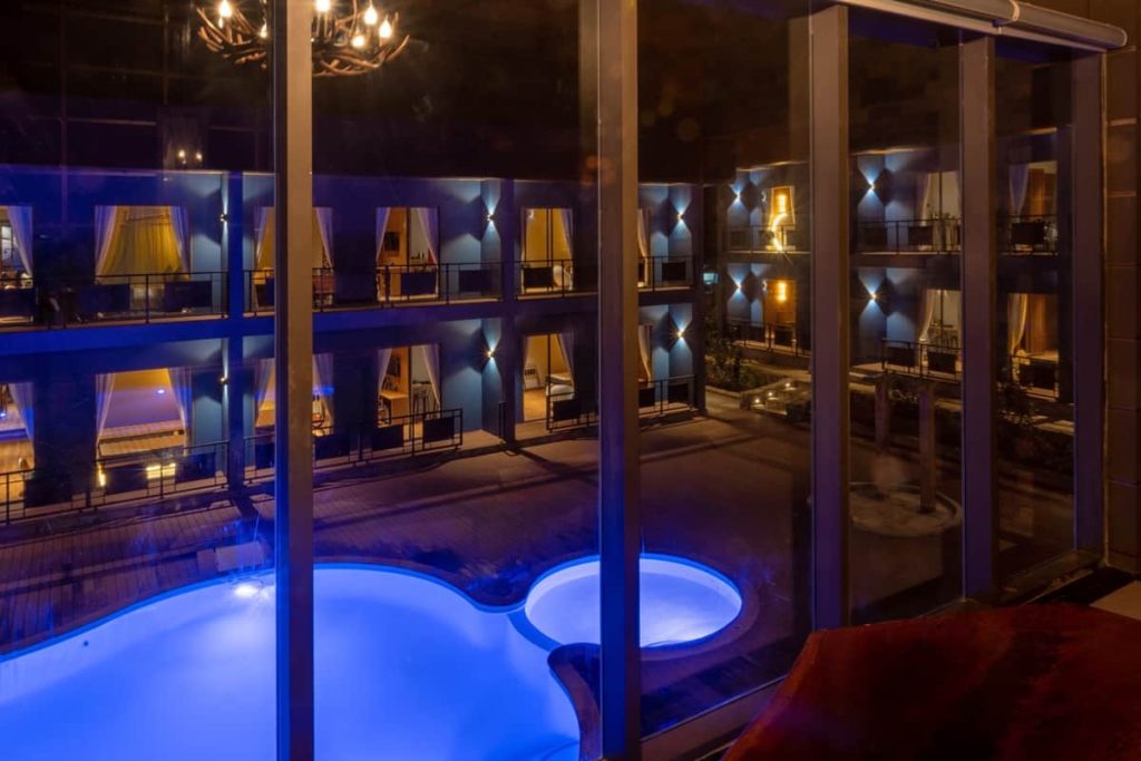 Luxury Duplex terrace overlooking the pool at night